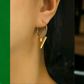 A golden arrowhead earrings