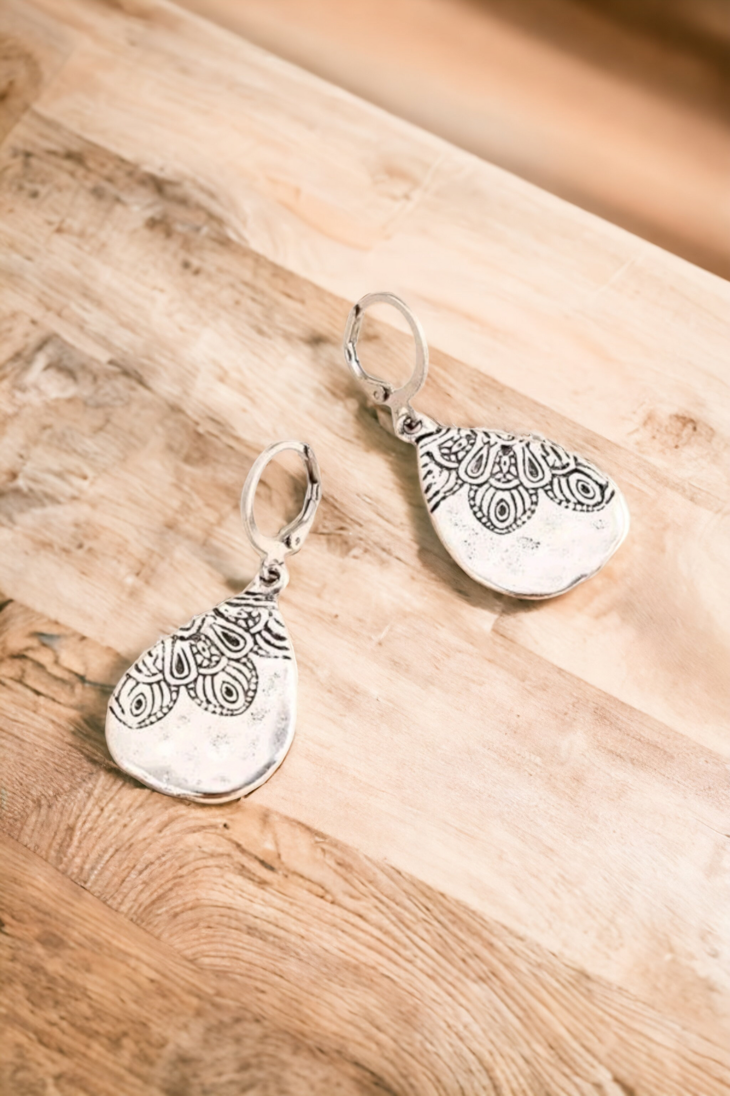 Embossed silver earrings