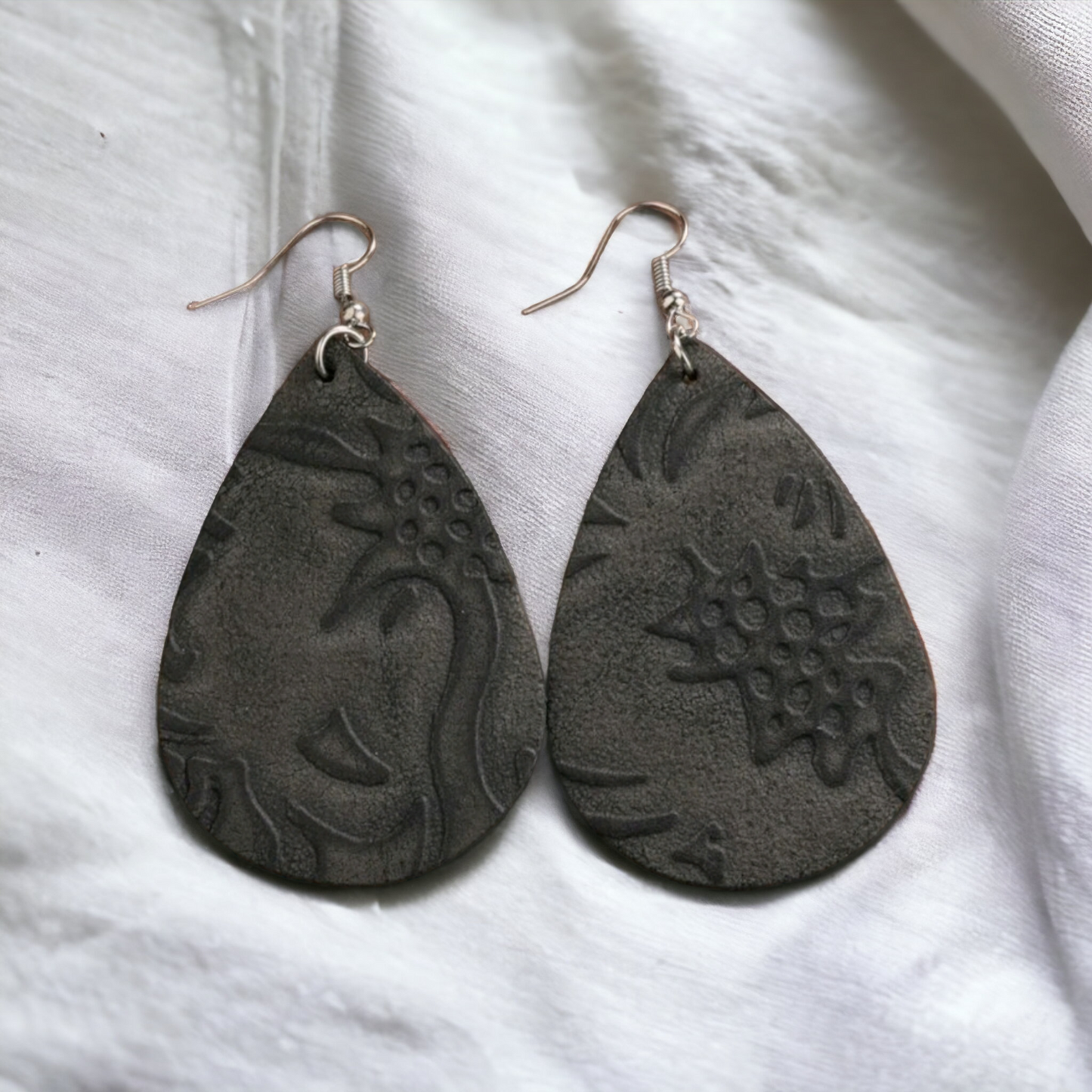 Suade parade embossed earrings