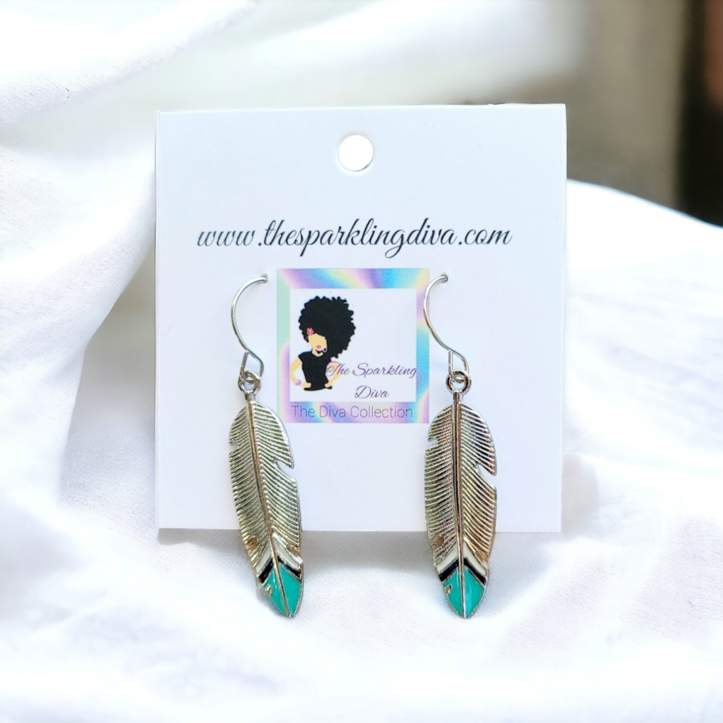 Silver dipped feather earrings